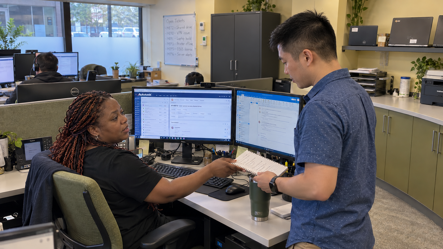 Client retention strategies: a primary and backup technician share notes beside the ticket queue