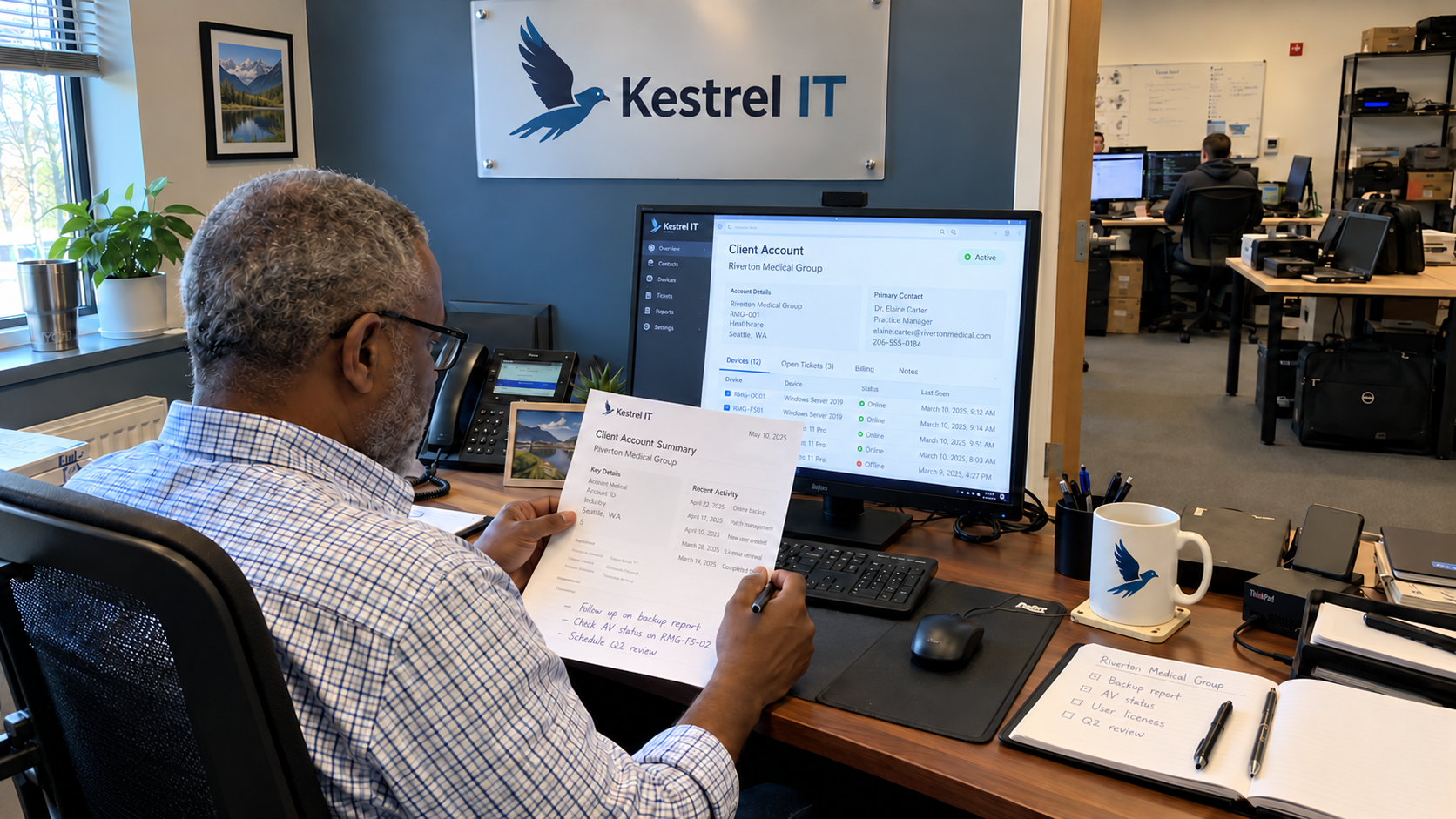 An MSP manager compares a printed client summary with the account records on his monitor