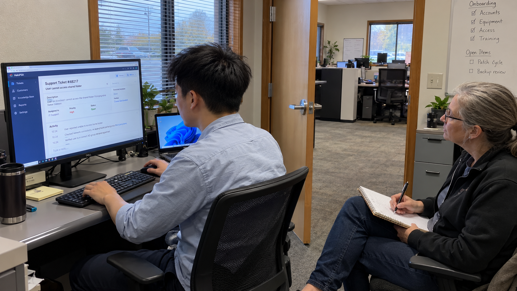 Candidate works a prepared support ticket during an IT support skills assessment at an MSP