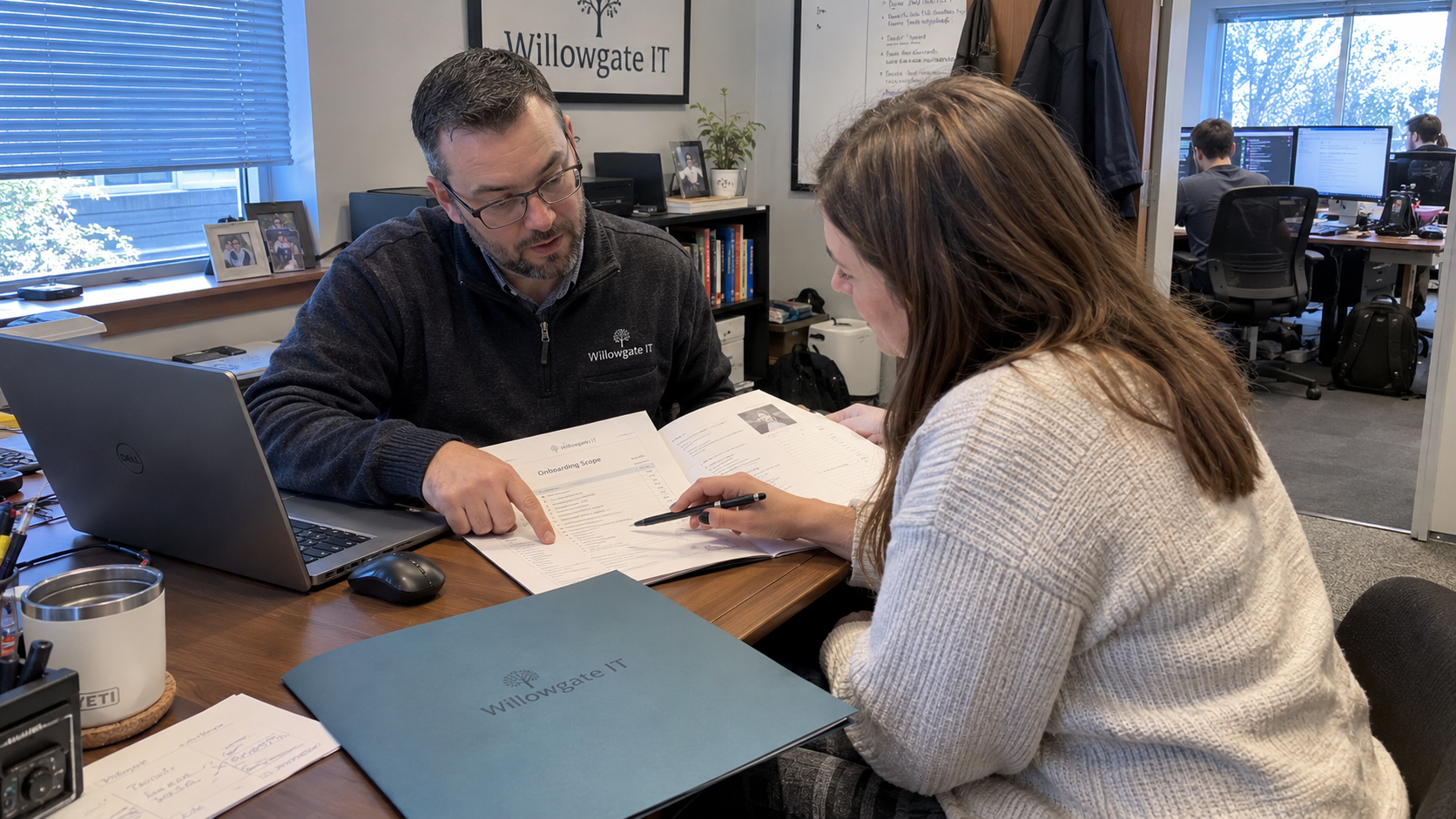 MSP owner and client review an MSP onboarding fee and the included scope on a service quote