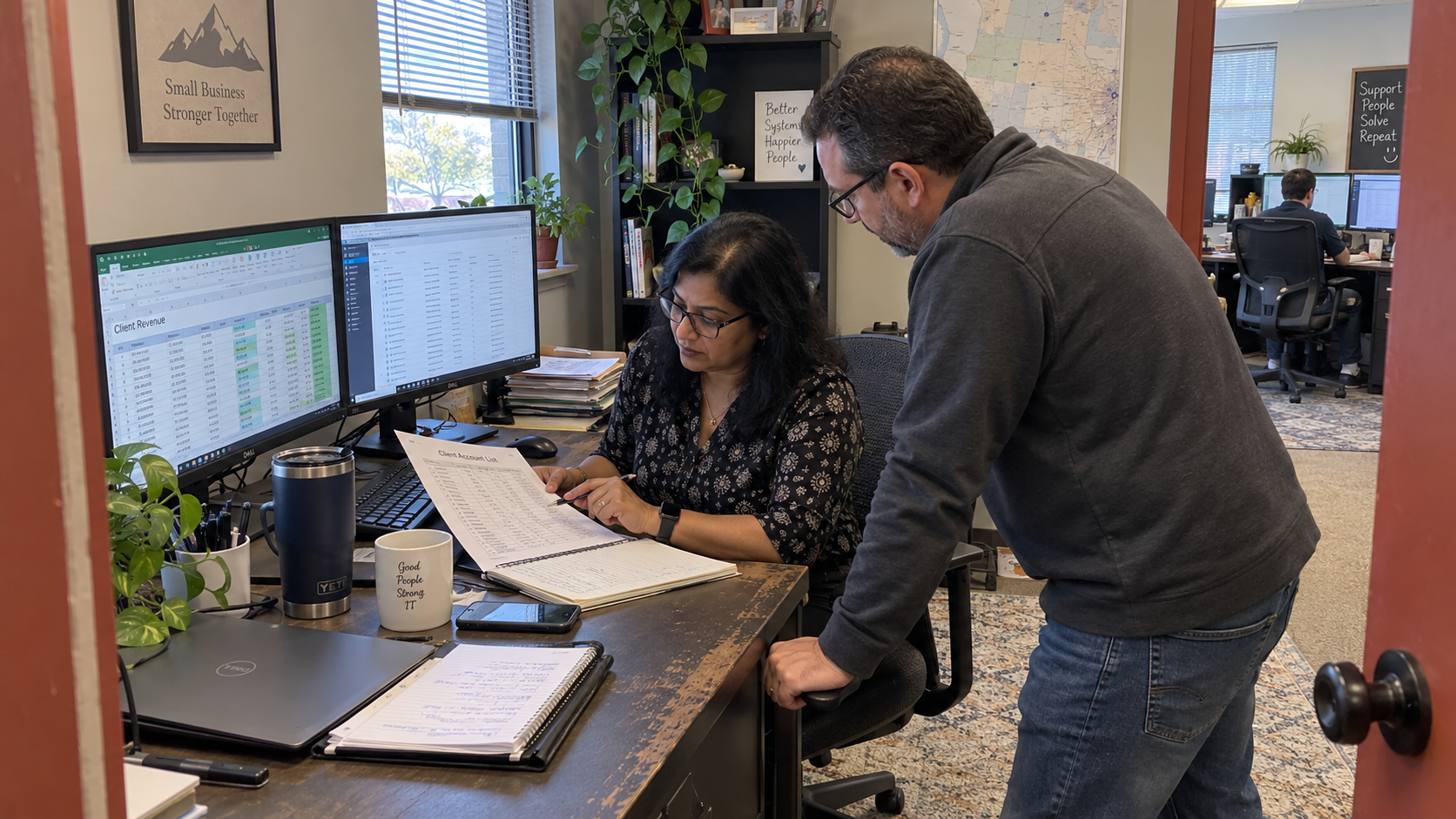 MSP owner and colleague check client revenue accounts to assess customer concentration risk