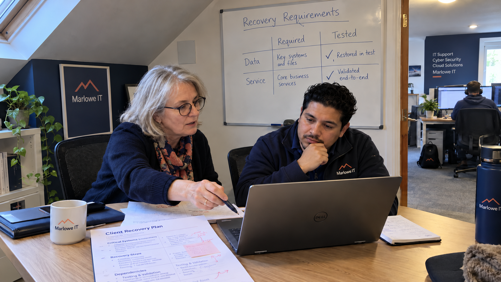 RPO vs RTO planning at an MSP desk with a client recovery plan and required-versus-tested whiteboard