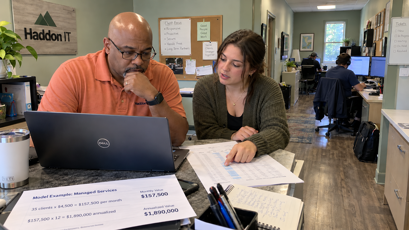 MSP owner and finance coordinator compare MRR vs ARR using client records and a model worksheet