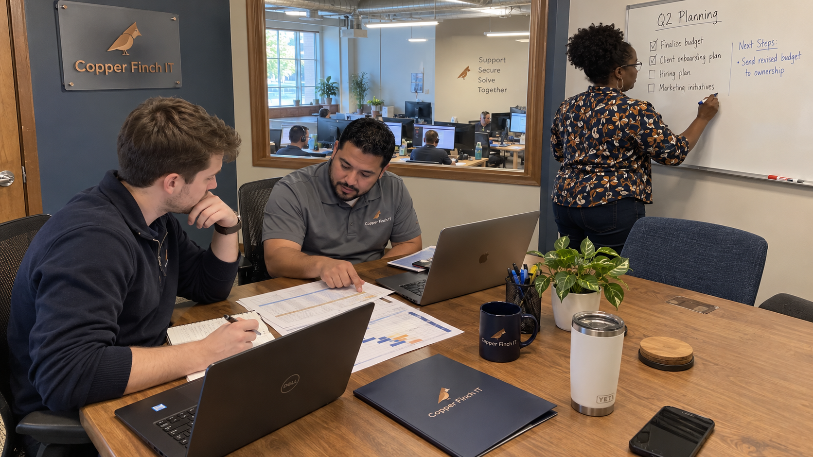 MSP owner records next actions while colleagues compare budgets in a quarterly planning meeting