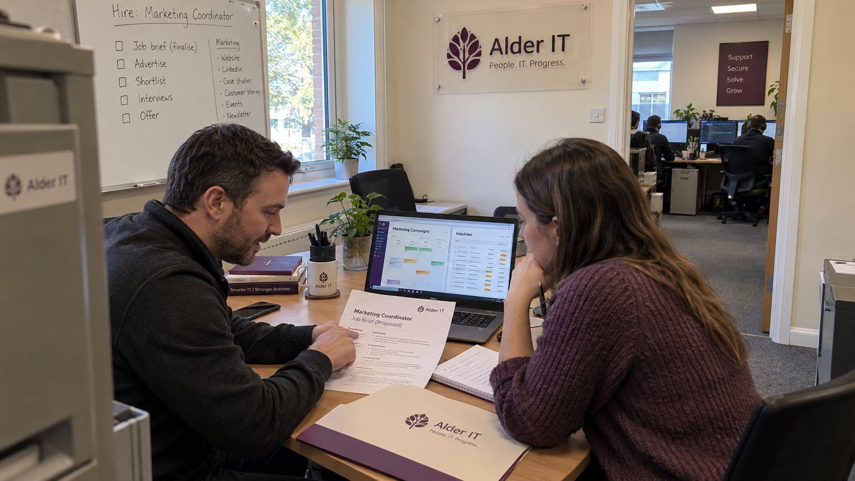 MSP owner and sales lead review a coordinator job brief and campaign records before their first marketing hire