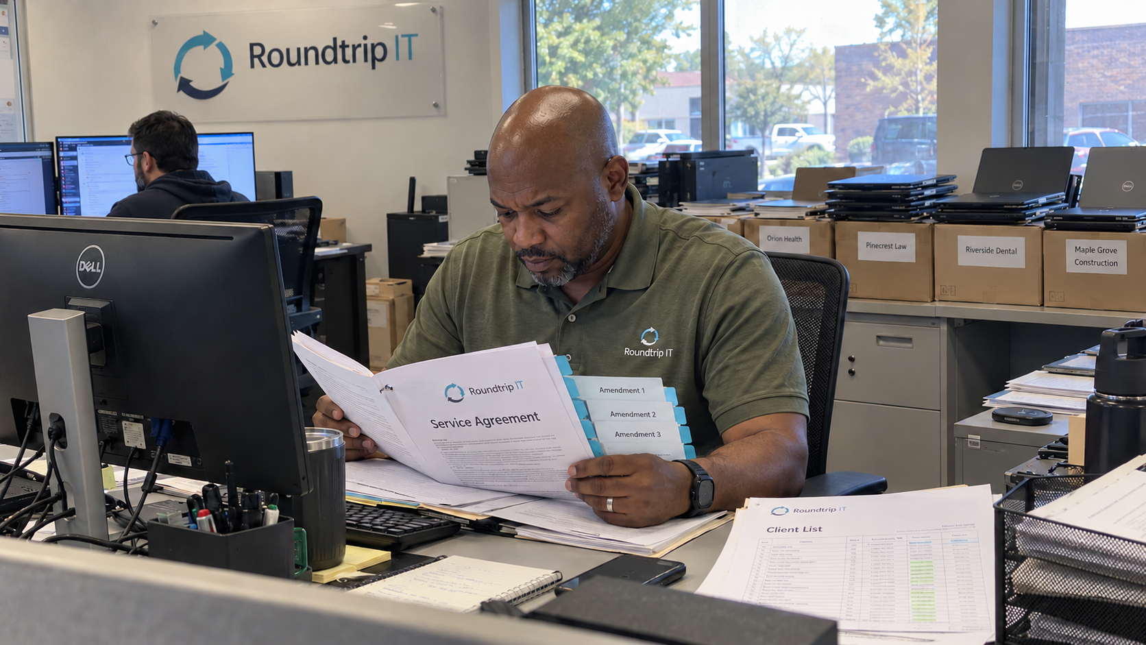 MSP owner reviews a service agreement and amendment tabs for a change of control clause assessment
