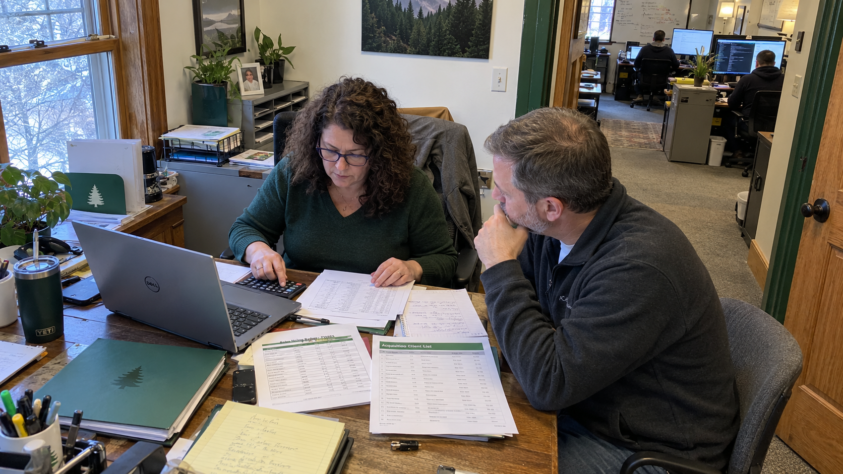 MSP owner compares acquisition vs organic growth using a client list, sales hiring budget, and calculator