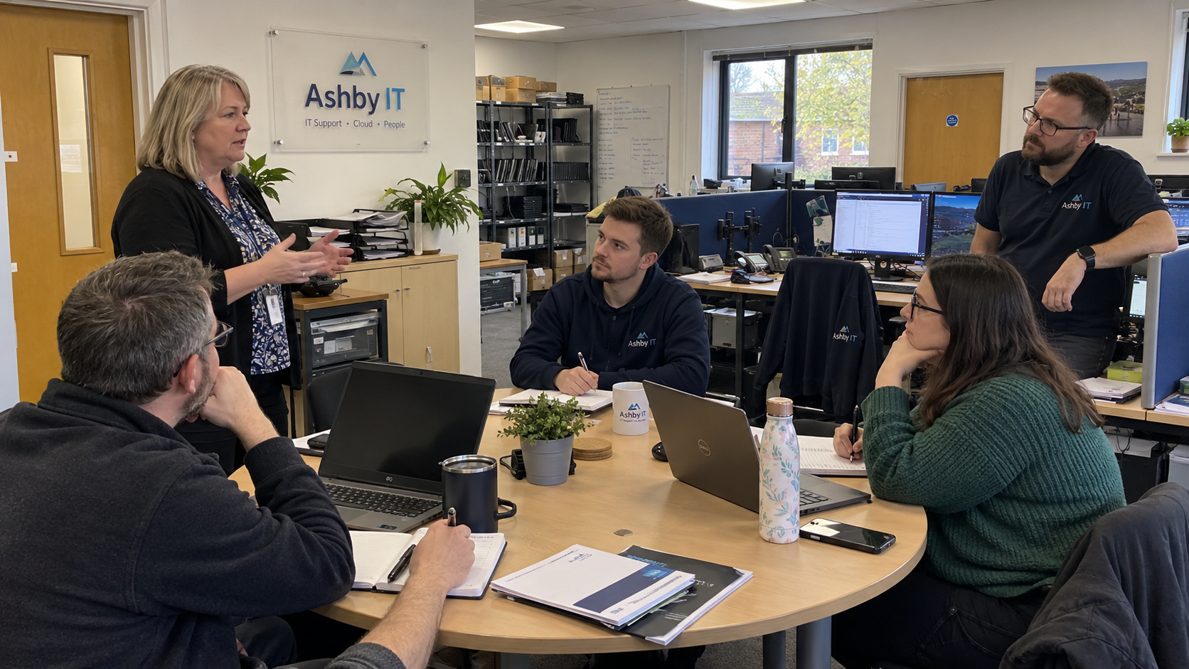 An MSP owner discusses how to tell employees you are selling the business with colleagues around a table.