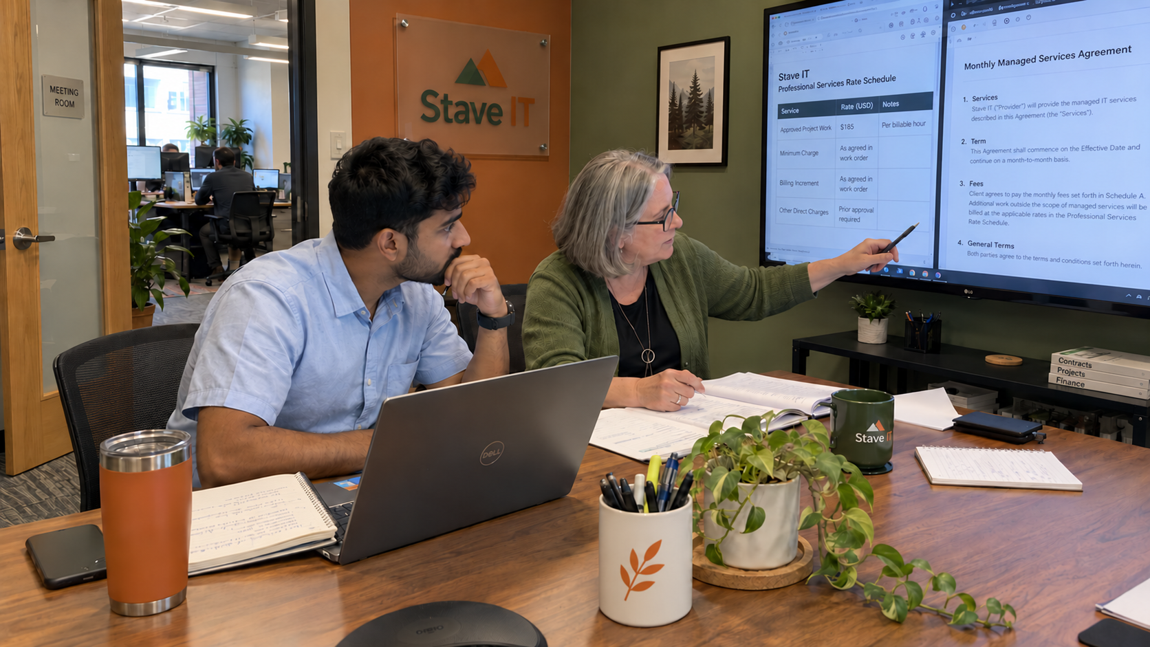 MSP account and billing staff compare an IT consultant hourly rate schedule with a monthly agreement.