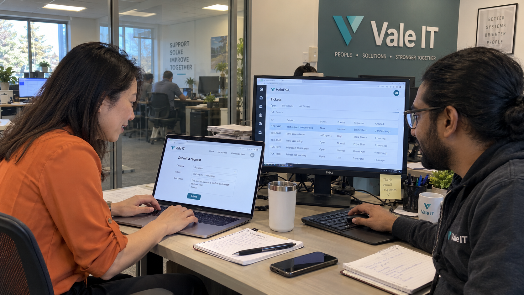 Client IT lead and MSP technician test a shared support request during co-managed IT onboarding.