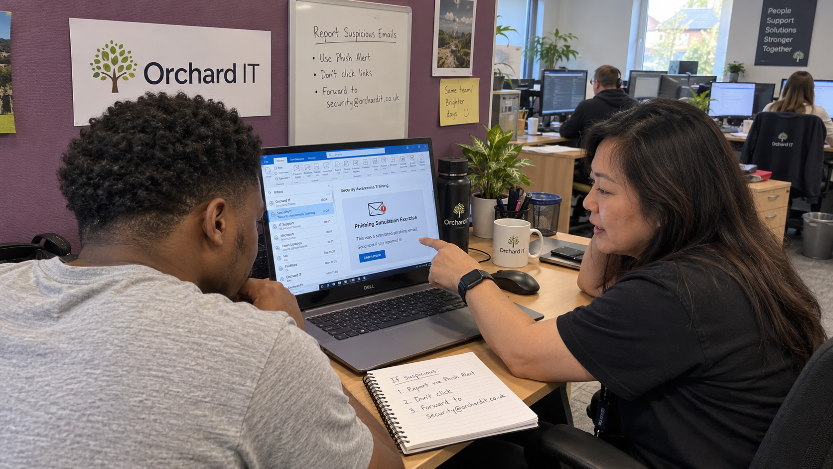 MSP training lead and technician review a phishing simulation email and its reporting route