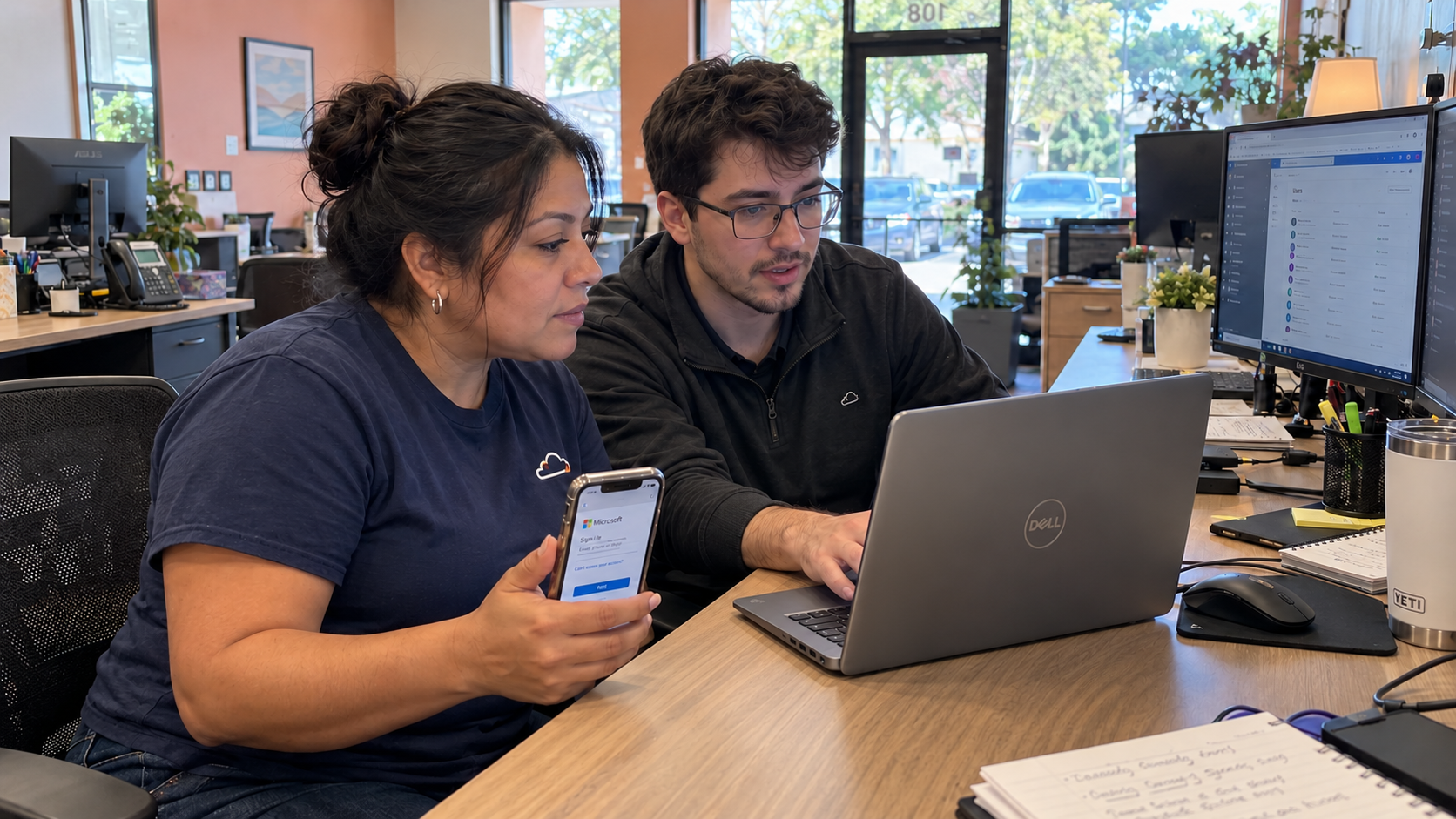 MSP technicians test laptop and phone sign-in as part of an MFA rollout plan
