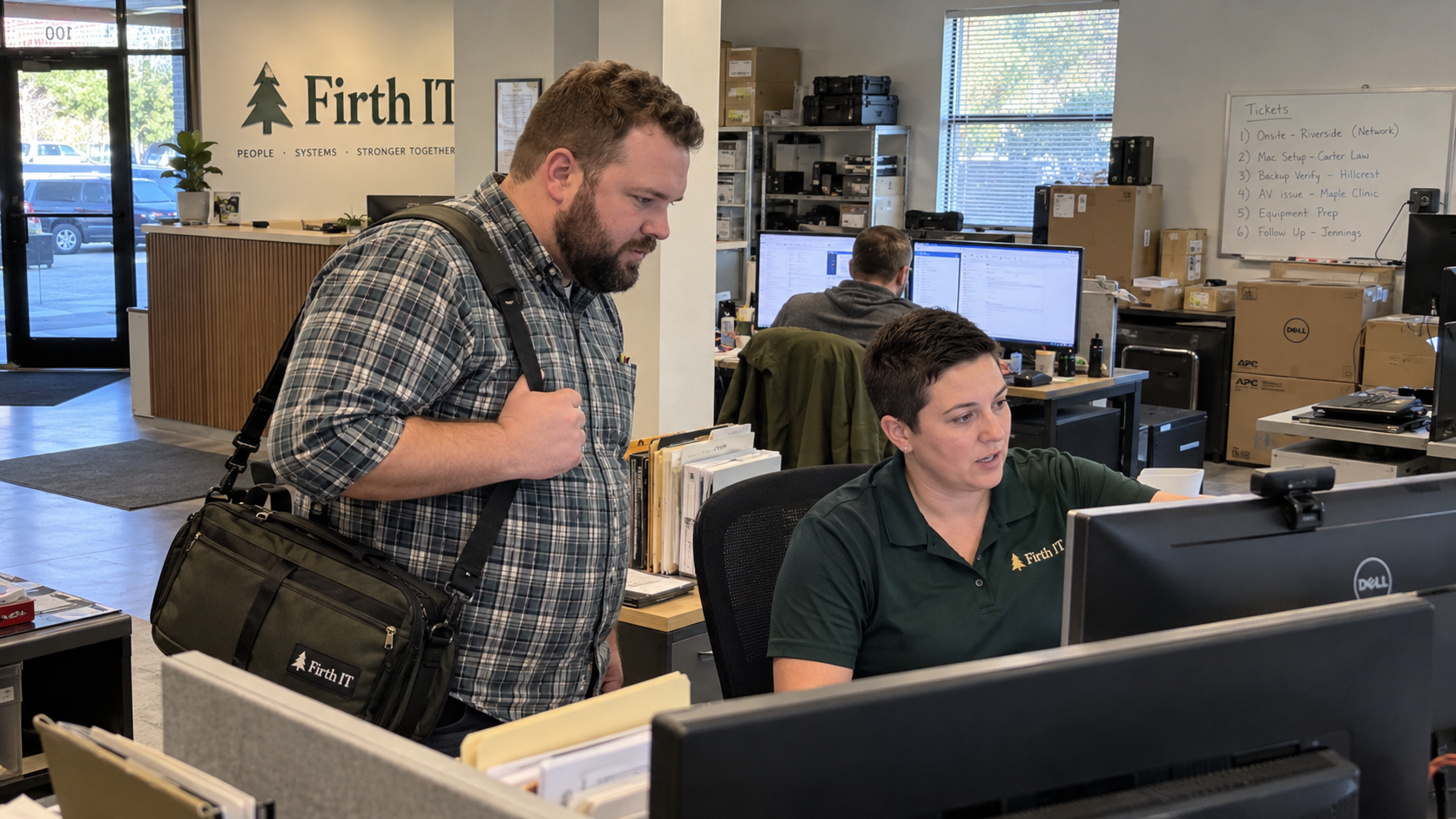 Dispatcher and field technician check a ticket before choosing remote vs onsite IT support