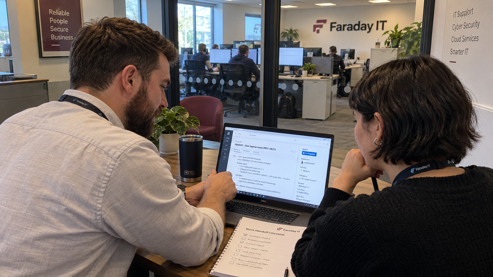 Service lead and technician review a handoff note privately while discussing technician performance metrics.